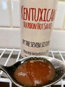 Kentuxican Bourbon Hot Sauce on a spoon