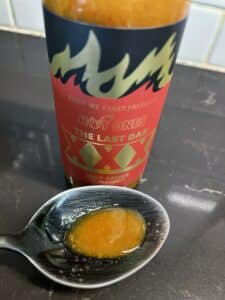 The Last Dab XXX Hot Sauce on a spoon